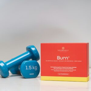 Two blue dumbbells and a box of burn supplement.
